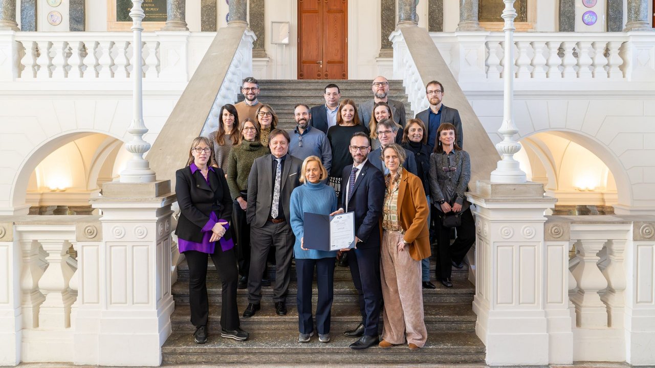 The group of participants at the event on the steps of the rectorate class=